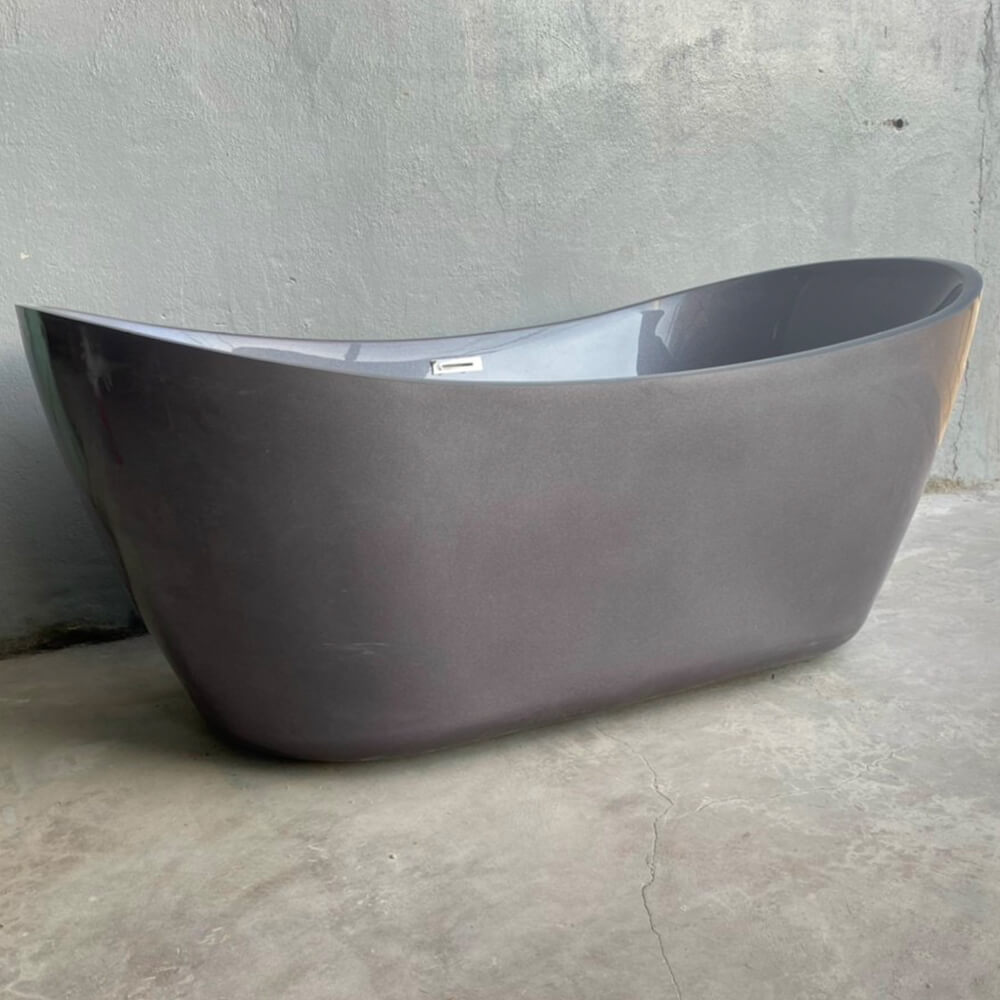 Góc nhìn bên hông của bồn tắm thỏi vàng màu xám